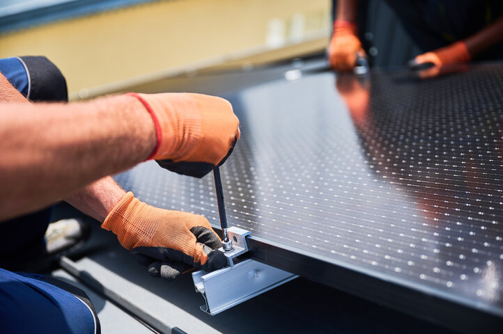 building photovoltaic solar panel system on rooftop of house